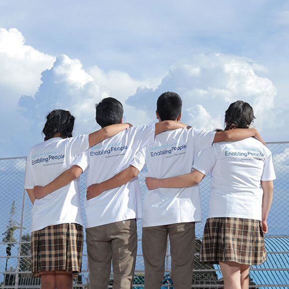 back view of the youth looking at the bright sky together