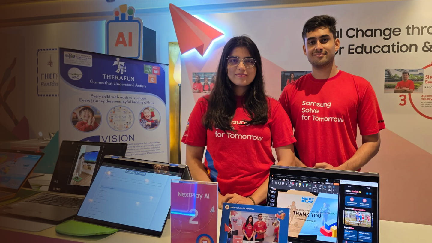 Aadish Abhijeet Shelke and Bhagyashri Heeralal Meena, co-founders of NextPlayAI, are being photographed at the company’s exhibition booth.